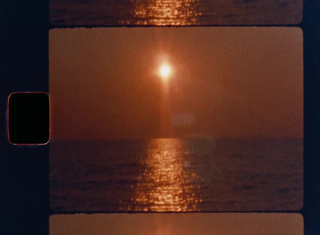 Cinematic sunset over the ocean captured on Super 8mm film, featuring the glowing sun reflecting across gentle waves in warm orange tones; nostalgic vintage seascape ideal for retro visuals, atmospheric scenes, and analog film aesthetics