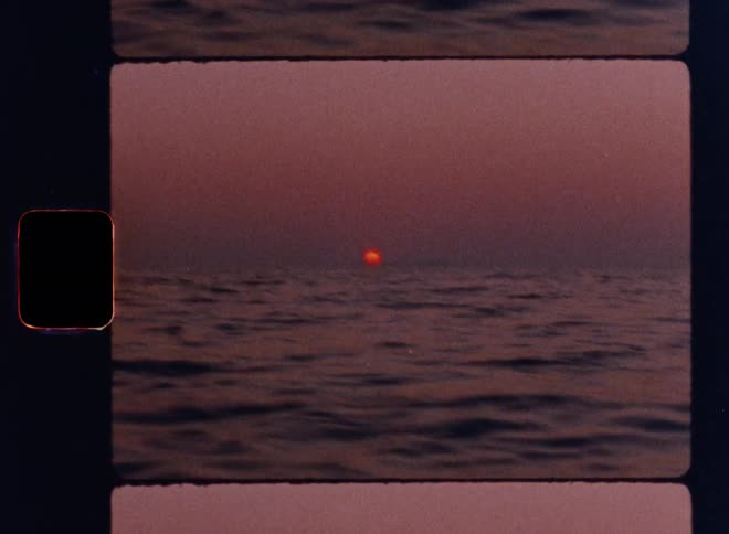Cinematic Super 8mm sunset over the ocean, with the glowing sun dipping toward the horizon and soft waves in the foreground, captured in nostalgic analog film grain for vintage travel, nature, and seascape aesthetics
