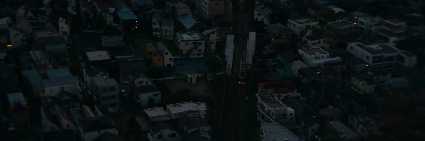 The sun is rising on the town full of homes