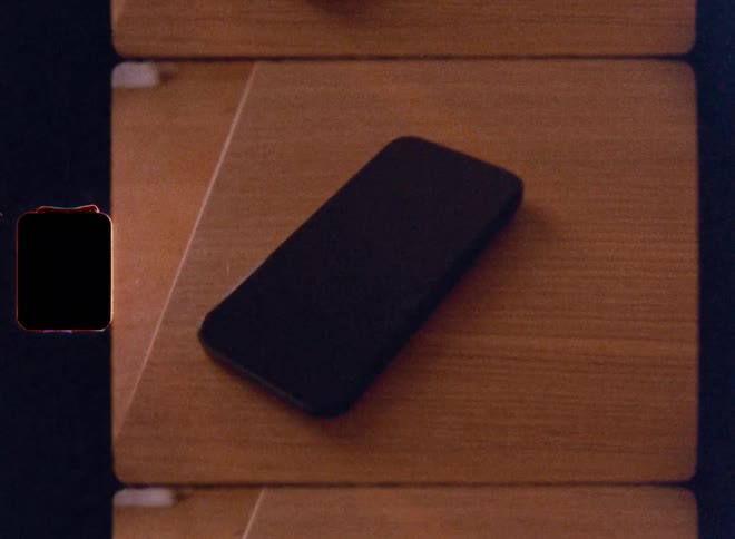 Smartphone on top of a wooden table