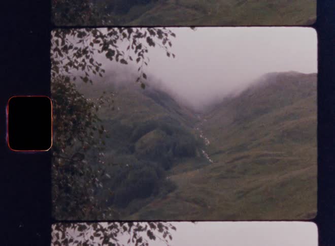 Fog covers the mountains ahead