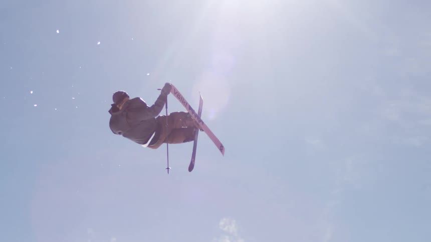 Person suspended in the air during aerial snowboarding stunt