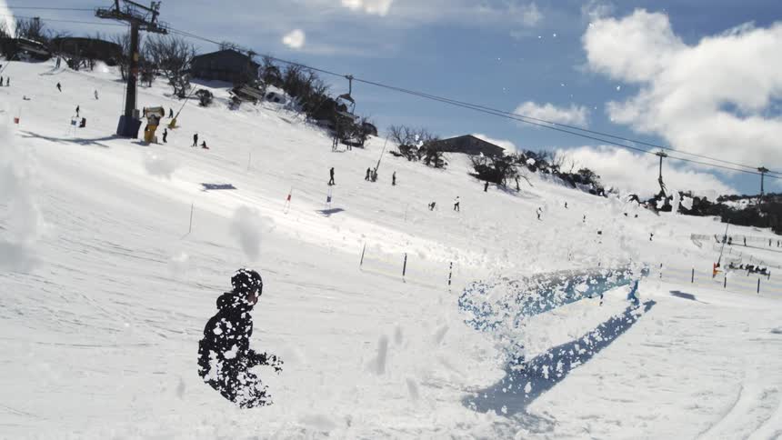 The person throws snow everywhere stopping on the skiis