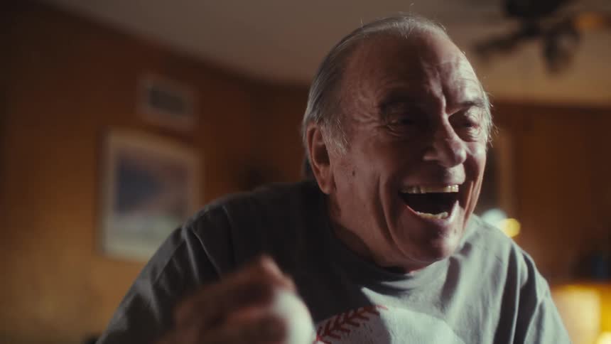 The man is cheering and clapping his hands