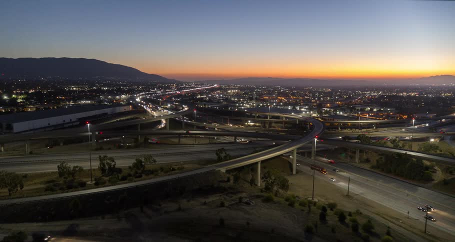 Aerial view of an overpass with vehicle traffic in the late afternoon