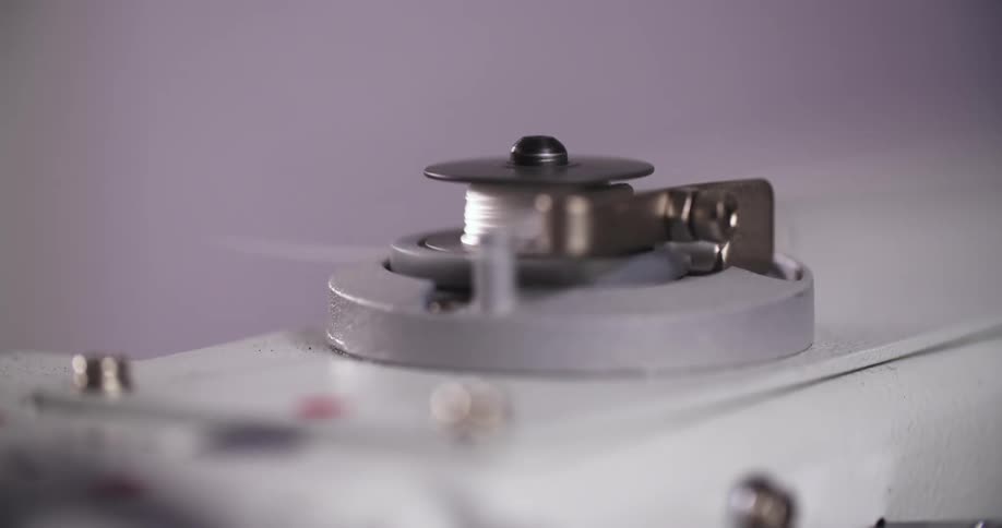 Sewing machine winds thread onto a bobbin