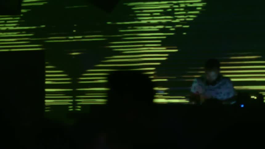 The lights are flashing in a busy club