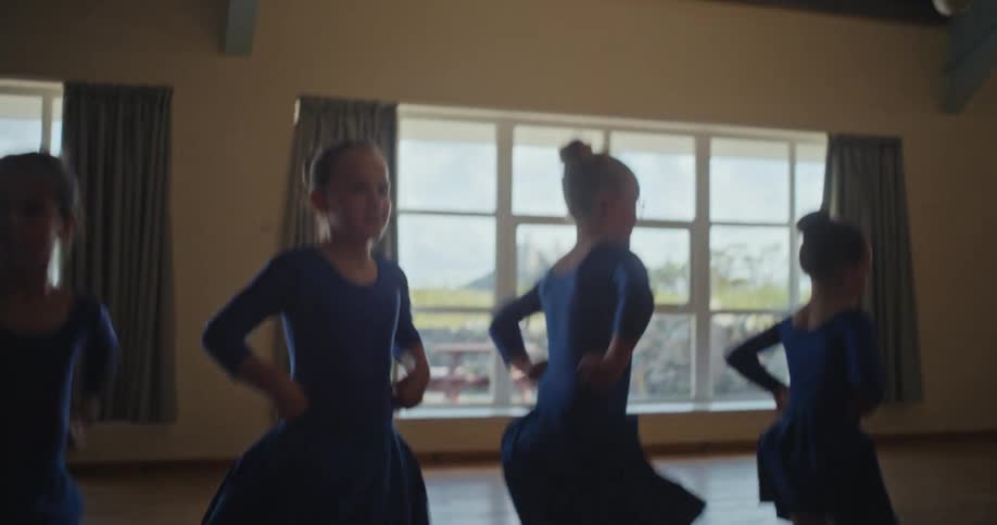 Four little girls dancing ballet in a rehearsal