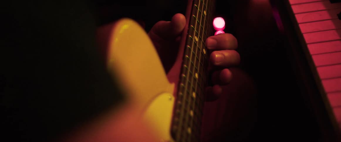 Hands of a person playing guitar