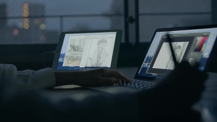 A person works on a laptop