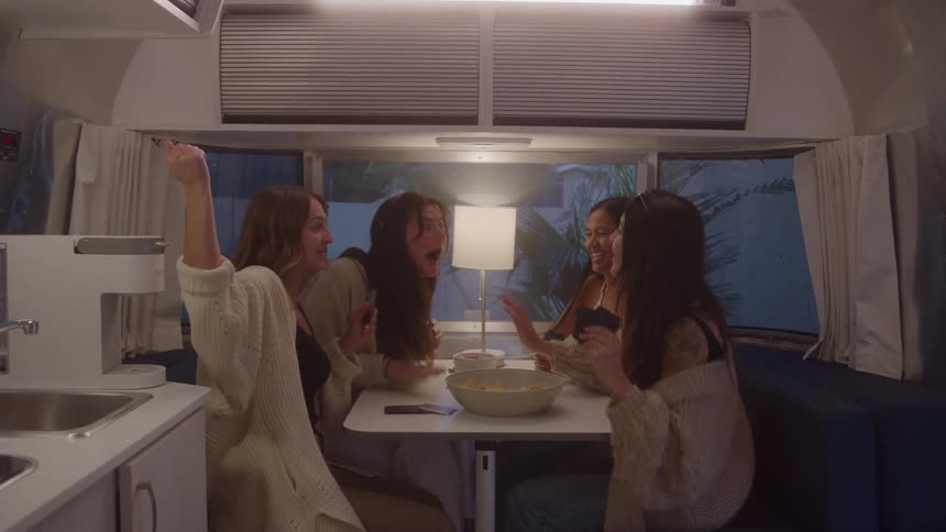 Women sitting at a table playing cards
