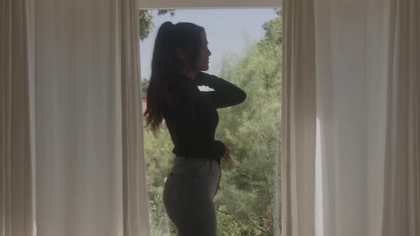 A woman is walking and looks very desperate and anxious about something