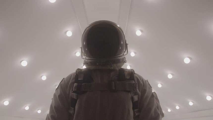 The astronaut has their helmet on