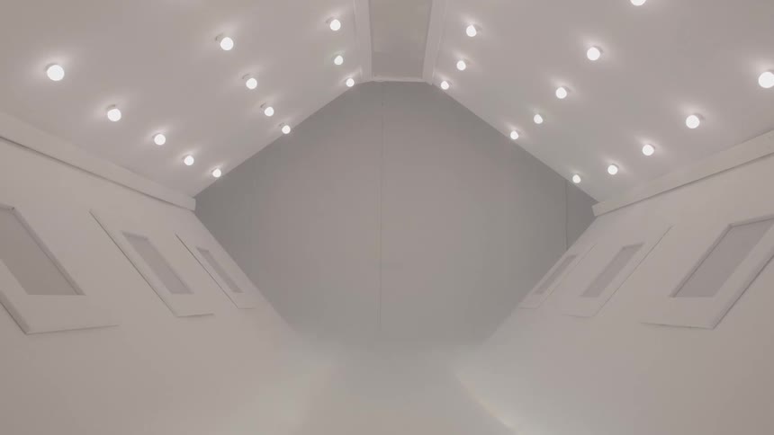 Interior of a futuristic room all in white with lights