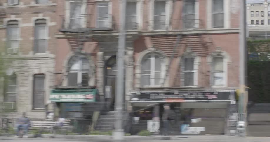 Cars drive on a city street
