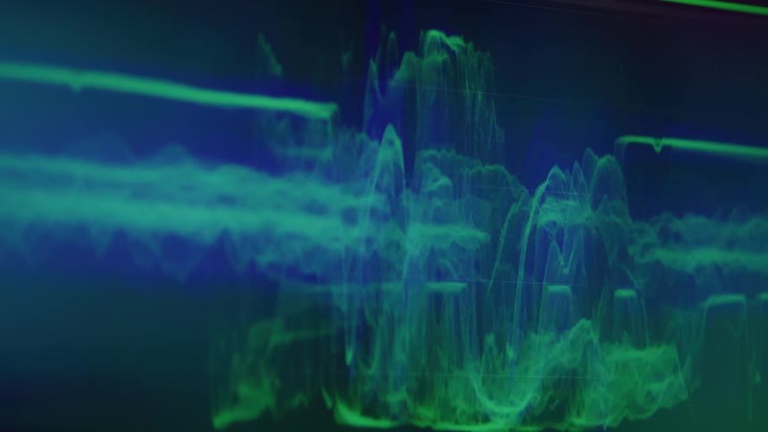 This clip features a digital visualizer with abstract colorful graphics on a dark background the bright neongreen and blue lines shift and move in a wavelike pattern reminiscent of a visual representation of sound