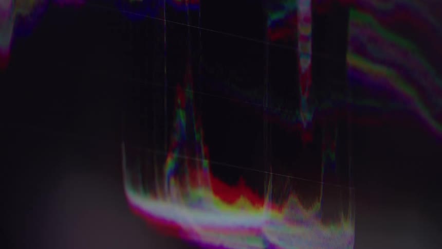 This abstract clip features a colorful digital pattern that shifts and changes the bright colors including reds greens and blues move in waves and vertical lines reminiscent of a visualizer for a sound wave