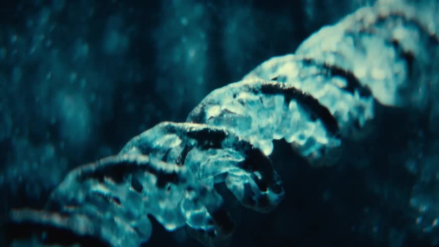 Closeup view of a crystal like dna helix against a blue background