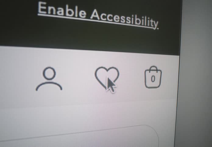 A cursor hovers over a heartshaped favorites icon between an account silhouette and an empty shopping bag beneath the heading enable accessibility