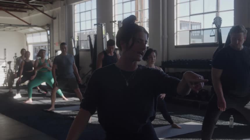 The people are stretching in the gym