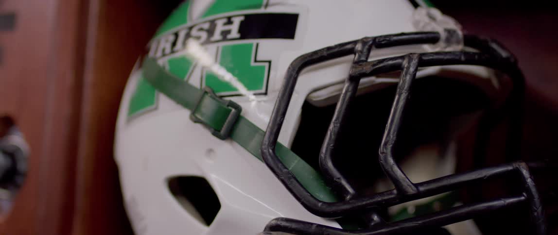 A football helmet is inside the locker