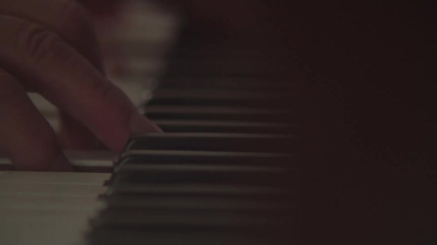 The man is playing the piano