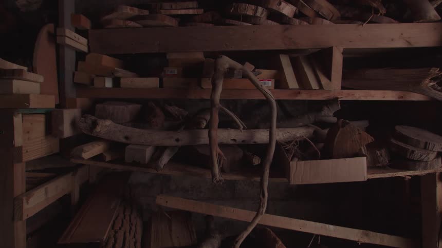Several wooden shelves full of things