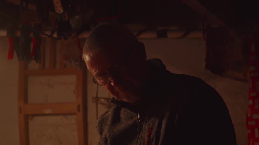 Close up portrait of a middle aged man working in a room