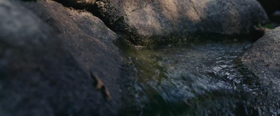 Close up of water flowing down rocks