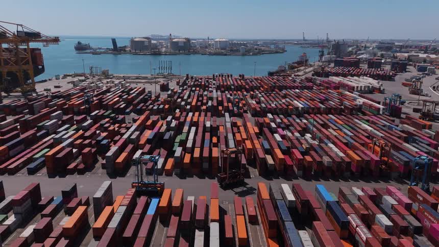 Aerial view of containers organized in a seaside port