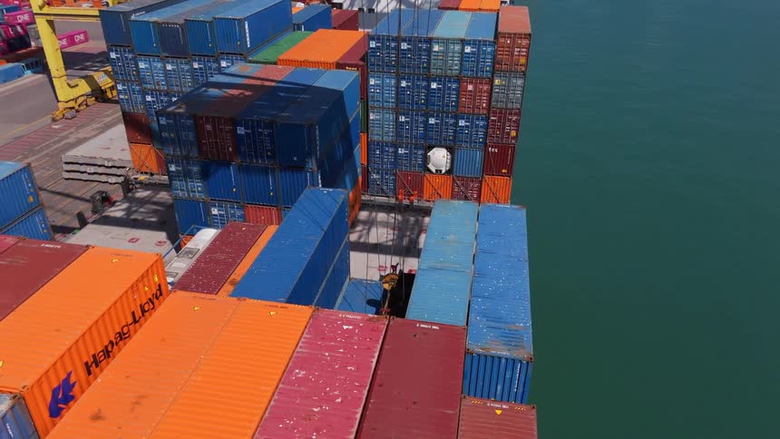 Containers arranged on a ship in a port