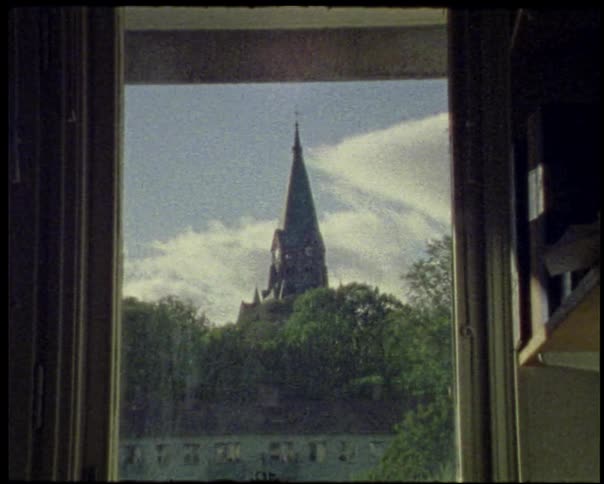 View of a church tower through a window