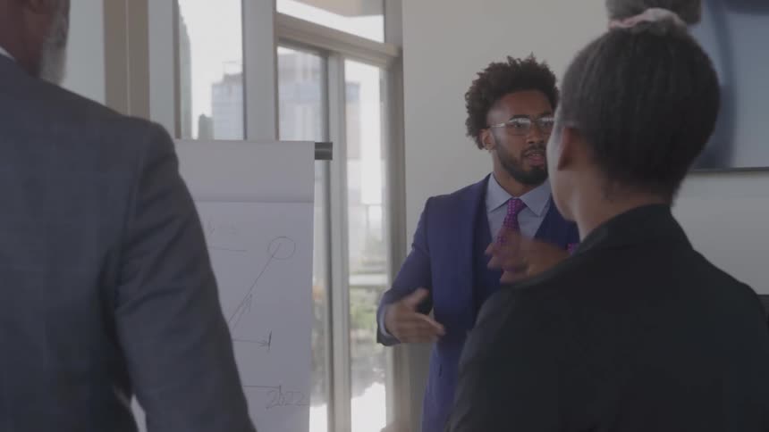 Small group of people talking in a meeting