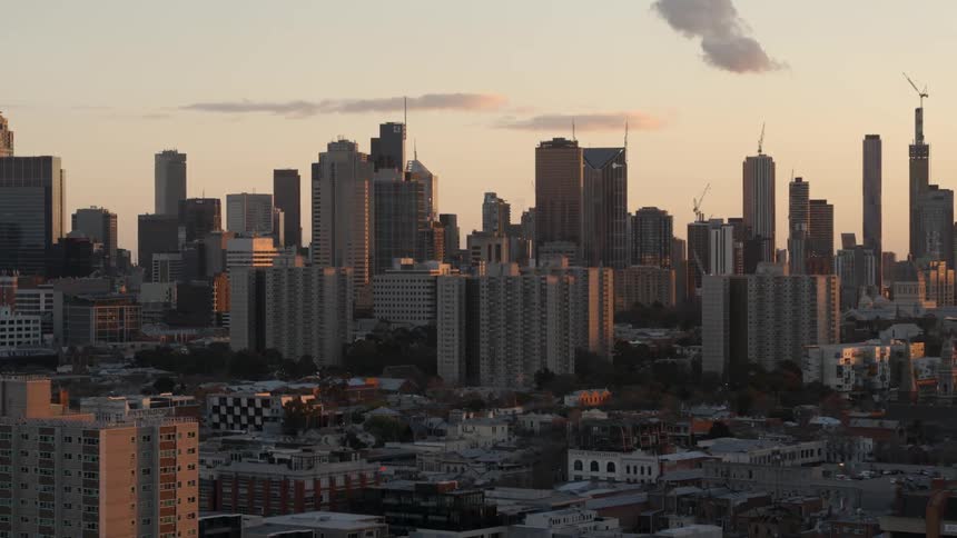 View of a large city with skyscrapers at sunrise