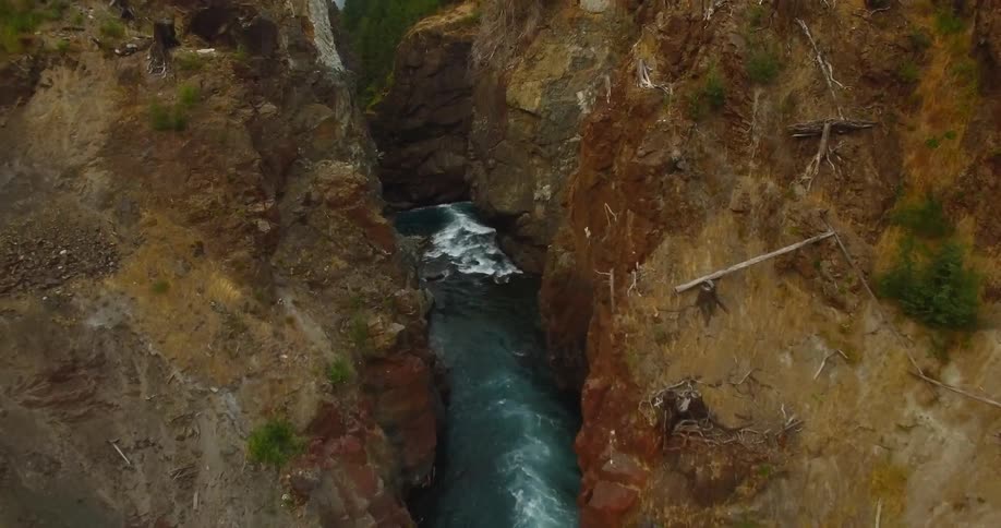 View of a river flowing through large rock formations