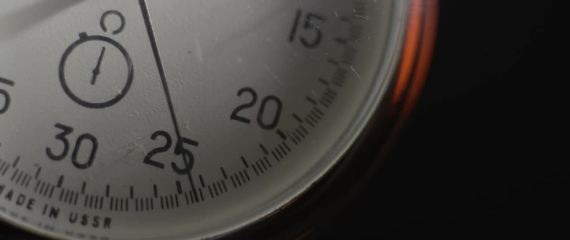 Close up of a stop watch while its hand is moving