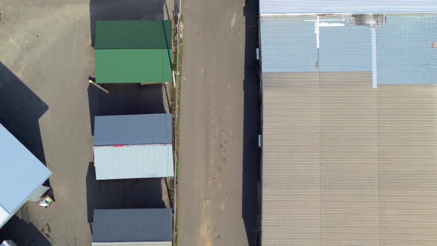 Aerial view of warehouses seen during the day