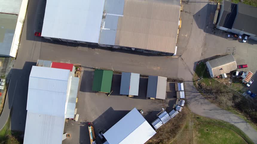 Aerial view of a factory complex with several buildings at midday