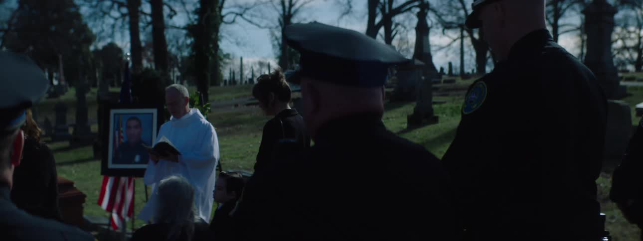 Group of police officers at a ceremony at the cemetery