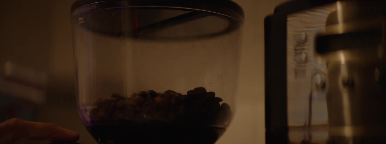 A person blending nuts in a blender