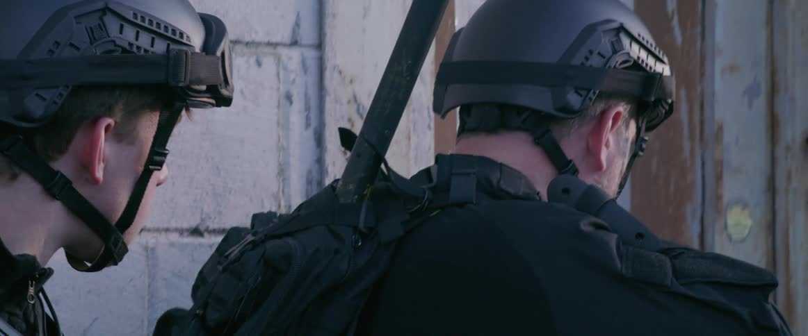 Police officers focused on a tactical operation