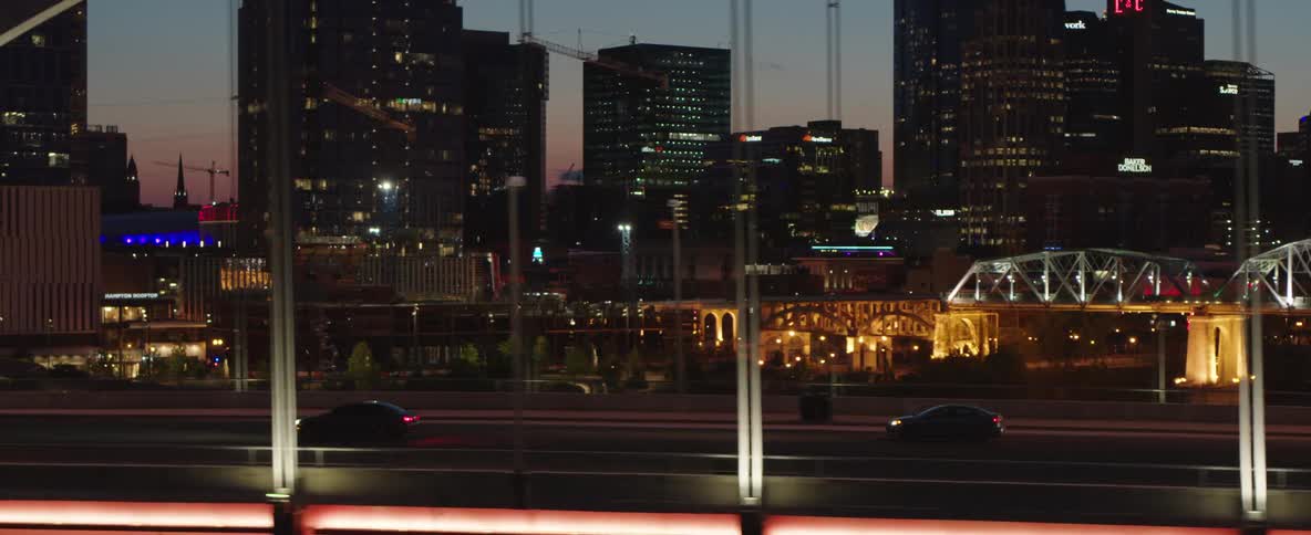 Cars travel over the bridge in the big city