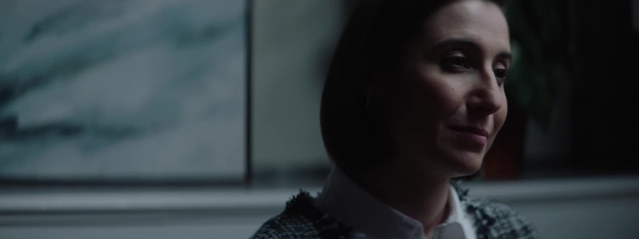The woman talks and smiles