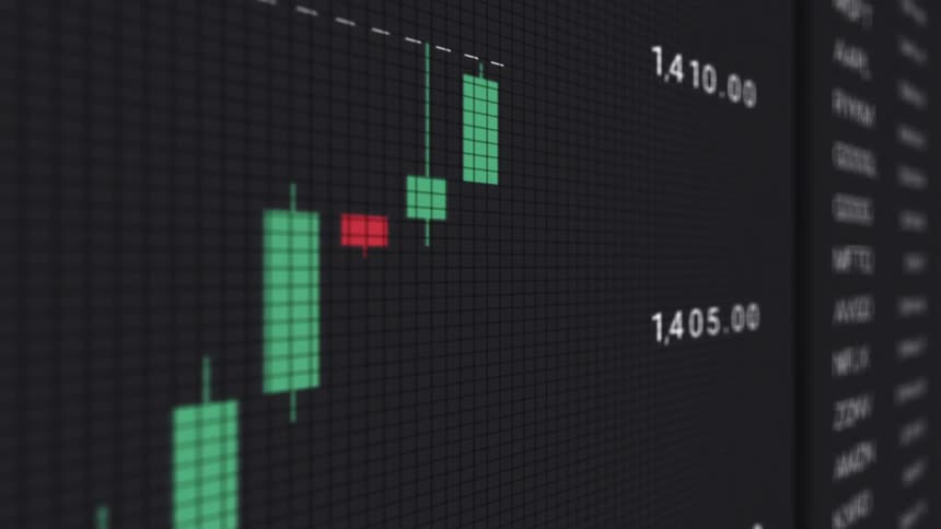 Close up of an electronic device screen displaying a trading interface with live moving candlesticks