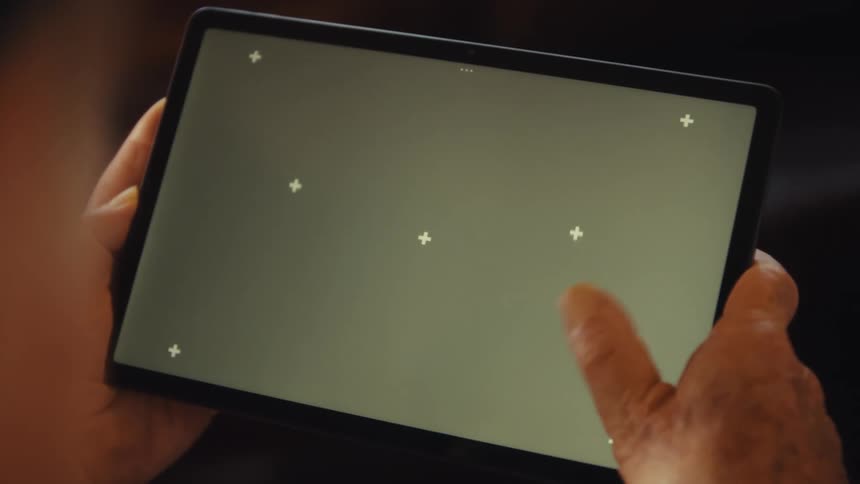 Person holds a tablet
