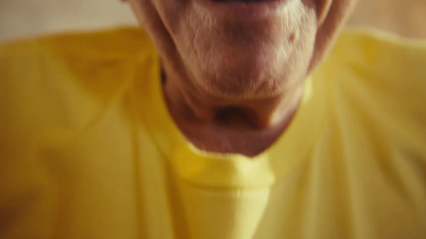 Elderly man laughing out loud