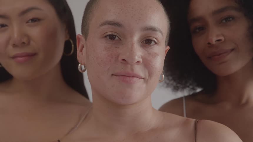 The women are modeling together and smiling