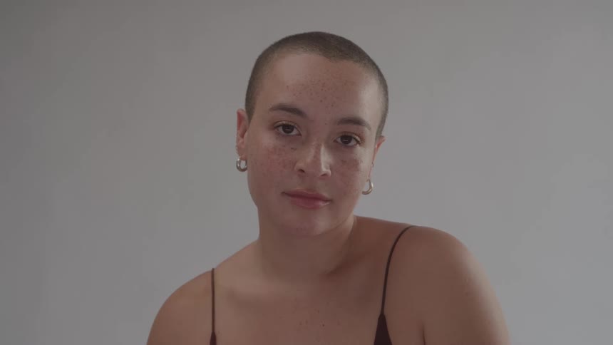The woman blinks her eyes while modeling