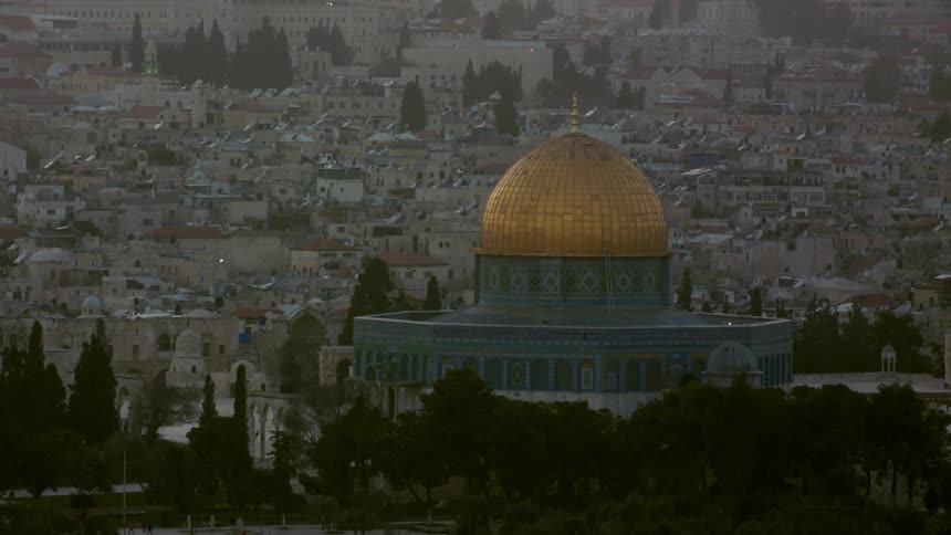 Round building with a copper dome in a city