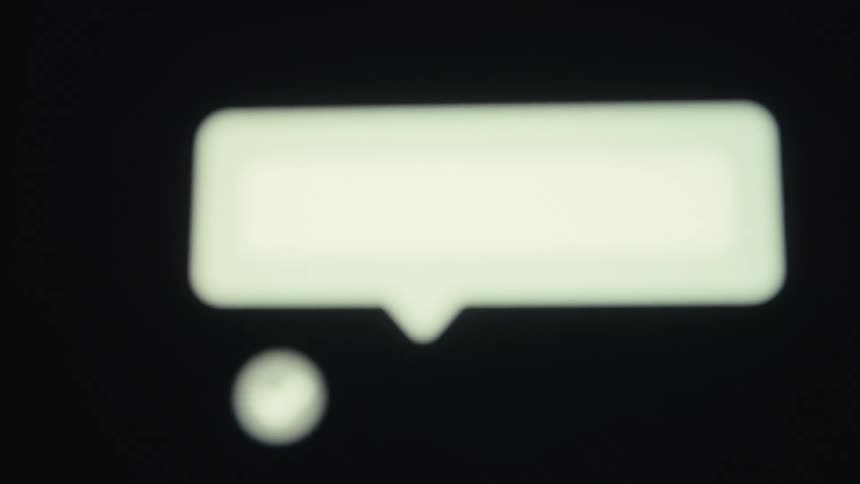 Message logo being typed on a black background